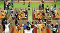 Inside the main mess hall, in-front of the bar.